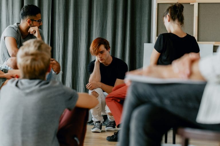 Worried boy in group